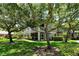 Beautiful condo with exterior balcony and lush landscaping surrounded by mature trees at 6552 Moorings Point Cir # 201, Lakewood Ranch, FL 34202