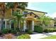 Charming home showcasing a well-manicured lawn and tropical landscaping for curb appeal at 6552 Moorings Point Cir # 201, Lakewood Ranch, FL 34202