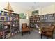 Cozy library featuring floor-to-ceiling bookshelves and comfortable seating for reading and relaxation at 6552 Moorings Point Cir # 201, Lakewood Ranch, FL 34202