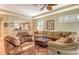 Spacious living room with comfortable seating, a ceiling fan, and natural light at 6552 Moorings Point Cir # 201, Lakewood Ranch, FL 34202