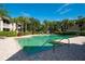 Inviting community swimming pool surrounded by lush landscaping and comfortable lounge chairs at 6552 Moorings Point Cir # 201, Lakewood Ranch, FL 34202
