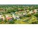This single-story home features a backyard pool with screened-in patio and solar panels on the roof at 7126 Southgate Ct, Sarasota, FL 34243