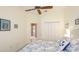 Bedroom featuring a ceiling fan, and ensuite bathroom with a walk in closet at 7126 Southgate Ct, Sarasota, FL 34243