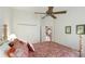 Bedroom featuring a bed, side table, ceiling fan, carpet, and curtains at 7126 Southgate Ct, Sarasota, FL 34243