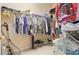 Walk-in closet featuring an organized system with multiple shelves, rods, and plenty of storage space at 7126 Southgate Ct, Sarasota, FL 34243