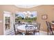 Bright breakfast nook features backyard views, casual dining, and access to the outdoor space at 7126 Southgate Ct, Sarasota, FL 34243