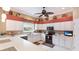 Well-lit kitchen features white cabinets, modern appliances, and ample counter space at 7126 Southgate Ct, Sarasota, FL 34243