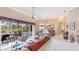 Bright living room featuring tile floors, ceiling fan, and sliding glass doors leading to outdoor living at 7126 Southgate Ct, Sarasota, FL 34243