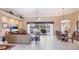 Spacious living room with tile floors, neutral paint, and large sliding glass doors leading to the patio at 7126 Southgate Ct, Sarasota, FL 34243
