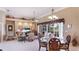 Open-concept living space with living room, dining area, and sliding doors to the outdoor patio at 7126 Southgate Ct, Sarasota, FL 34243