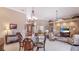 Spacious living area with dining table, living room seating, and an open layout at 7126 Southgate Ct, Sarasota, FL 34243