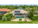 This single-story home features a backyard pool with screened-in patio and solar panels on the roof at 7126 Southgate Ct, Sarasota, FL 34243