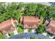 Stunning aerial view of the property showing the roof, driveway, and surrounding landscape at 7160 Cedar Hollow Cir, Bradenton, FL 34203