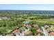 Expansive aerial view of the community showcasing mature landscaping and nearby water feature at 7160 Cedar Hollow Cir, Bradenton, FL 34203