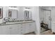 Bright bathroom featuring double sinks, granite countertops and a glass enclosed shower at 7160 Cedar Hollow Cir, Bradenton, FL 34203