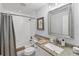 Cozy bathroom with shower and tub combo with granite vanity at 7160 Cedar Hollow Cir, Bradenton, FL 34203