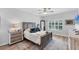 Bedroom with a ceiling fan, area rug and large window with view to exterior at 7160 Cedar Hollow Cir, Bradenton, FL 34203