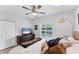 Bedroom with dark wood dresser and shutters letting in natural light at 7160 Cedar Hollow Cir, Bradenton, FL 34203