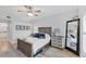 Bedroom with a ceiling fan, area rug, full sized mirror and decor at 7160 Cedar Hollow Cir, Bradenton, FL 34203