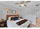 Bedroom with neutral color scheme, ceiling fan and laminate floors at 7160 Cedar Hollow Cir, Bradenton, FL 34203