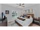 Comfortable bedroom with ceiling fan, accent lighting, and plush bedding at 7160 Cedar Hollow Cir, Bradenton, FL 34203