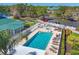 Aerial shot of the community pool, complete with lounge chairs and well-maintained landscaping at 7160 Cedar Hollow Cir, Bradenton, FL 34203