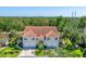 Inviting exterior view of home with tile roof, manicured lawn, and a two-car garage at 7160 Cedar Hollow Cir, Bradenton, FL 34203