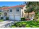 Charming home exterior with lush lawn, a two-car garage, and manicured landscaping at 7160 Cedar Hollow Cir, Bradenton, FL 34203