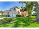 Charming home exterior with lush lawn, a two-car garage, and manicured landscaping at 7160 Cedar Hollow Cir, Bradenton, FL 34203