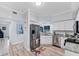 Bright kitchen featuring stainless steel appliances, granite countertops and light wood floors at 7160 Cedar Hollow Cir, Bradenton, FL 34203