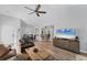 Open concept living room featuring high ceilings and a combined dining area at 7160 Cedar Hollow Cir, Bradenton, FL 34203