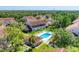 Community pool surrounded by manicured landscaping and comfortable lounge chairs for residents to enjoy at 7160 Cedar Hollow Cir, Bradenton, FL 34203