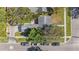 Birds-eye view of home showing roof, backyard patio, garage, and street parking in a quiet neighborhood at 777 51St N Ave, St Petersburg, FL 33703