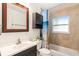 Clean bathroom with a shower-tub combo, tiled walls, and modern vanity with sink at 777 51St N Ave, St Petersburg, FL 33703