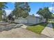 Charming single-story home with a detached garage, fenced yard, and well-maintained landscaping at 777 51St N Ave, St Petersburg, FL 33703