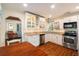 Modern kitchen with white cabinetry, granite countertops, and stainless steel appliances at 777 51St N Ave, St Petersburg, FL 33703