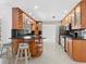 Modern kitchen features stainless steel appliances and tile flooring at 7779 Holiday N Dr, Sarasota, FL 34231