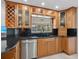 Well-lit kitchen boasts granite countertops and lots of cabinet space at 7779 Holiday N Dr, Sarasota, FL 34231