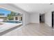 Open living area with tile floors and sliding glass doors leading to the pool at 7779 Holiday N Dr, Sarasota, FL 34231