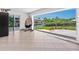 Open living area with tile floors and sliding glass doors leading to a canal view at 7779 Holiday N Dr, Sarasota, FL 34231