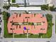 Aerial view of condominium building with red tile roof and courtyard at 800 S Blvd Of The Presidents # 5, Sarasota, FL 34236