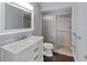 This bathroom features a glass shower door and ample counter space at 800 S Blvd Of The Presidents # 5, Sarasota, FL 34236