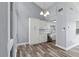 Charming dining area featuring light gray walls, hardwood floors, and modern stainless steel appliances at 800 S Blvd Of The Presidents # 5, Sarasota, FL 34236