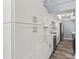 Bright kitchen with white cabinets, quartz countertops, and stainless steel appliances at 800 S Blvd Of The Presidents # 5, Sarasota, FL 34236