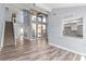 Bright living area featuring stairs to a loft, views to the kitchen, and many windows for natural light at 800 S Blvd Of The Presidents # 5, Sarasota, FL 34236