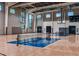 Indoor basketball court with refinished wood flooring for multi-sport activity at 8273 Shooting Star Rd, Sarasota, FL 34241