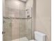 Modern bathroom showcasing a glass-enclosed shower with stylish tile work and fixtures at 8273 Shooting Star Rd, Sarasota, FL 34241