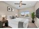 Bright and stylish bedroom with ceiling fan, plush carpet, and a serene atmosphere at 8273 Shooting Star Rd, Sarasota, FL 34241