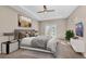 Relaxing bedroom featuring tray ceilings, neutral walls, and sliding glass doors for a bright, airy feel at 8273 Shooting Star Rd, Sarasota, FL 34241