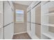 Walk-in closet with custom shelving, offering ample storage space at 8273 Shooting Star Rd, Sarasota, FL 34241